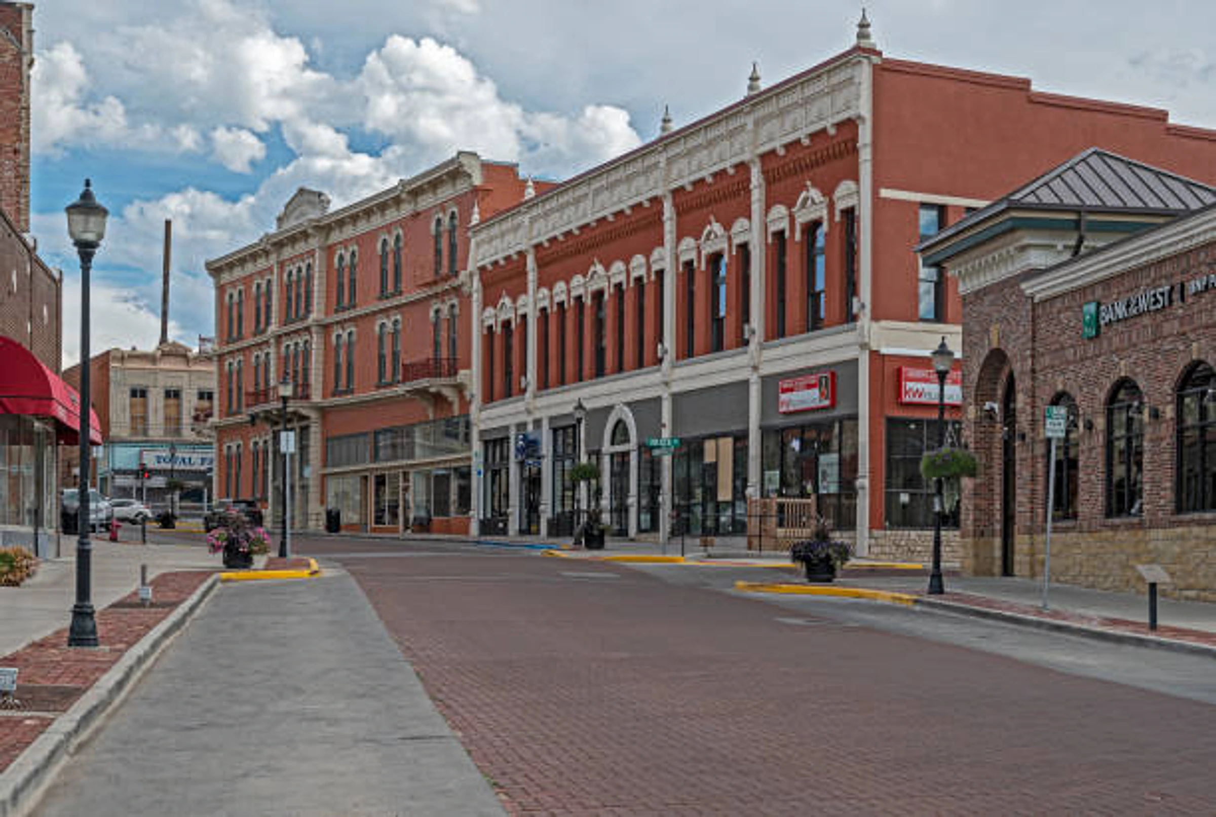 Historic red-brick storefronts along a quiet street in downtown Trinidad, Colorado